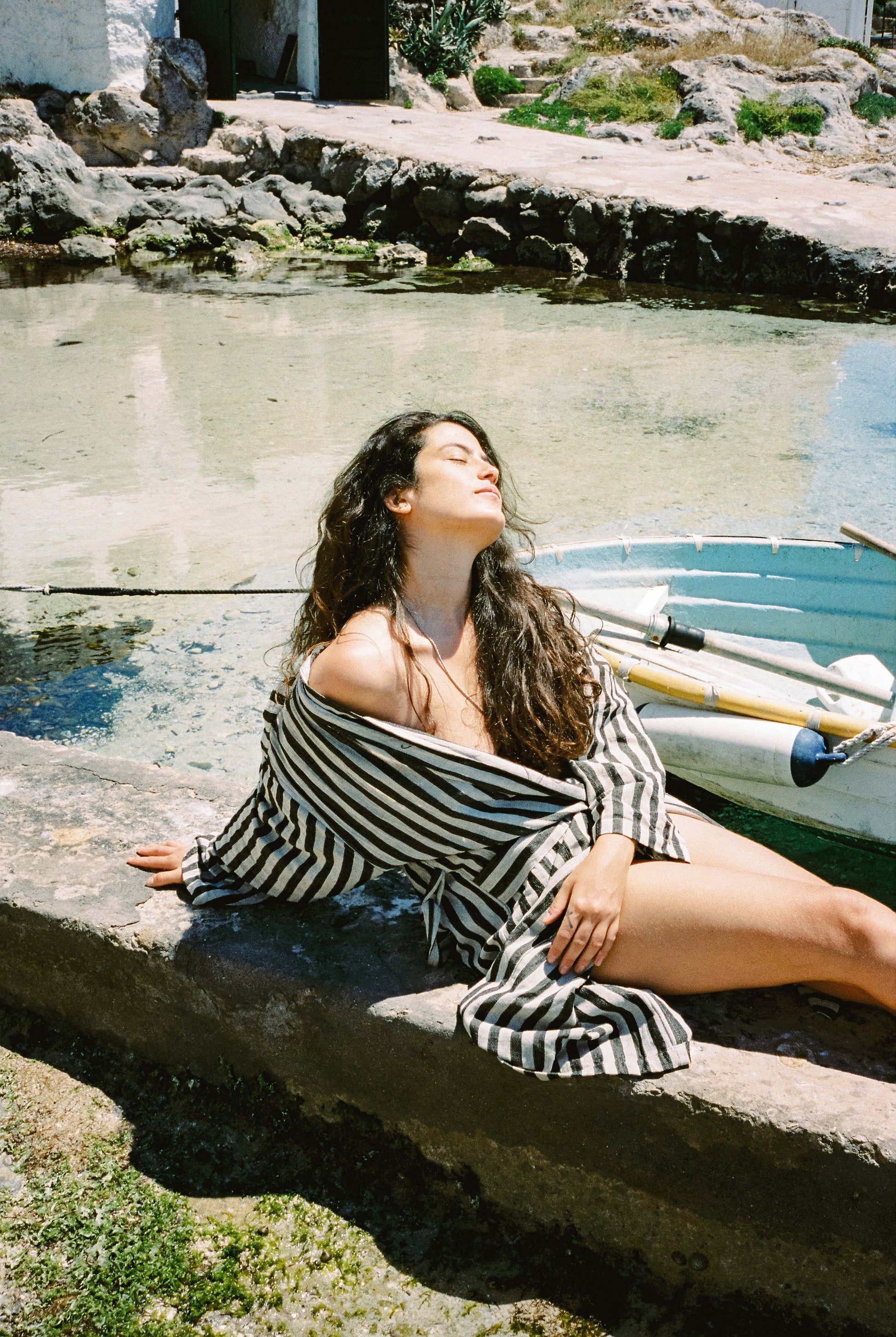 nuria cervera with striped black robe in mallorca