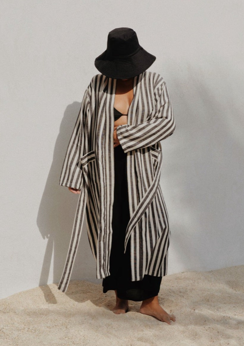 vianca with striped black robe in the island