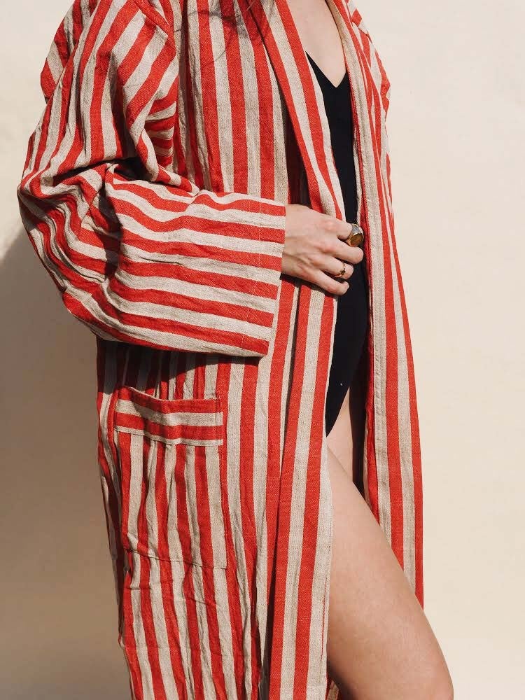 keyla with striped red robe from side