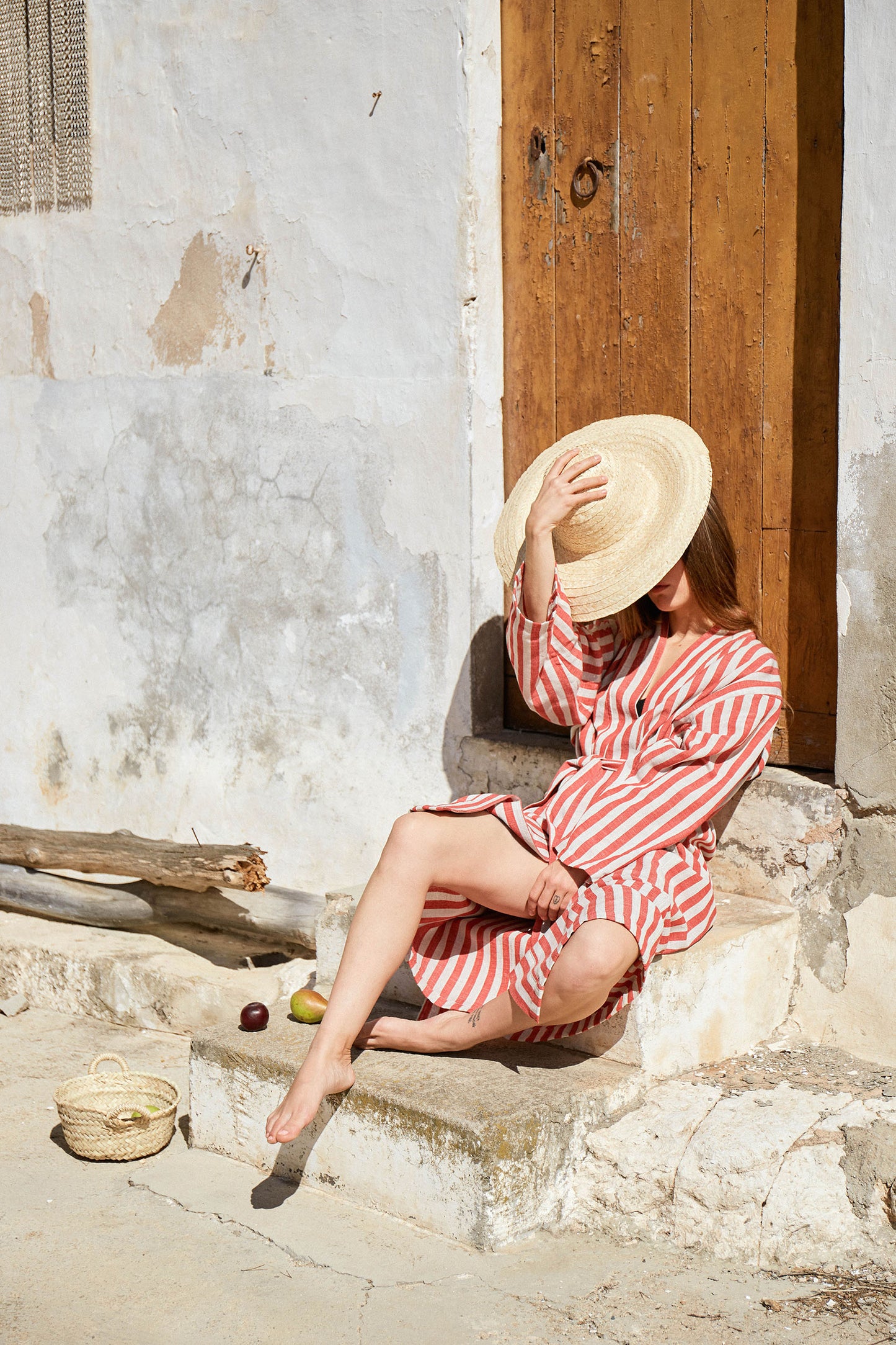 espe enjoying sun in mallorca with striped red robe